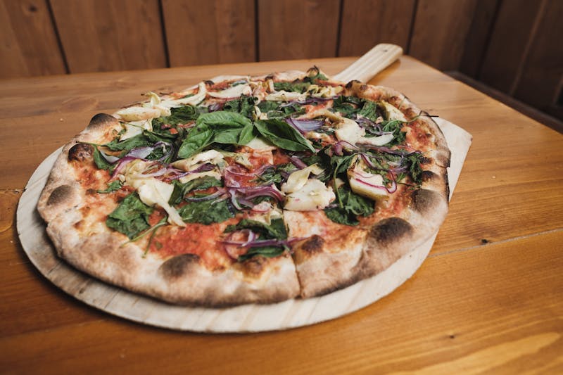 White pizza with roasted garlic and fresh basil Via 313